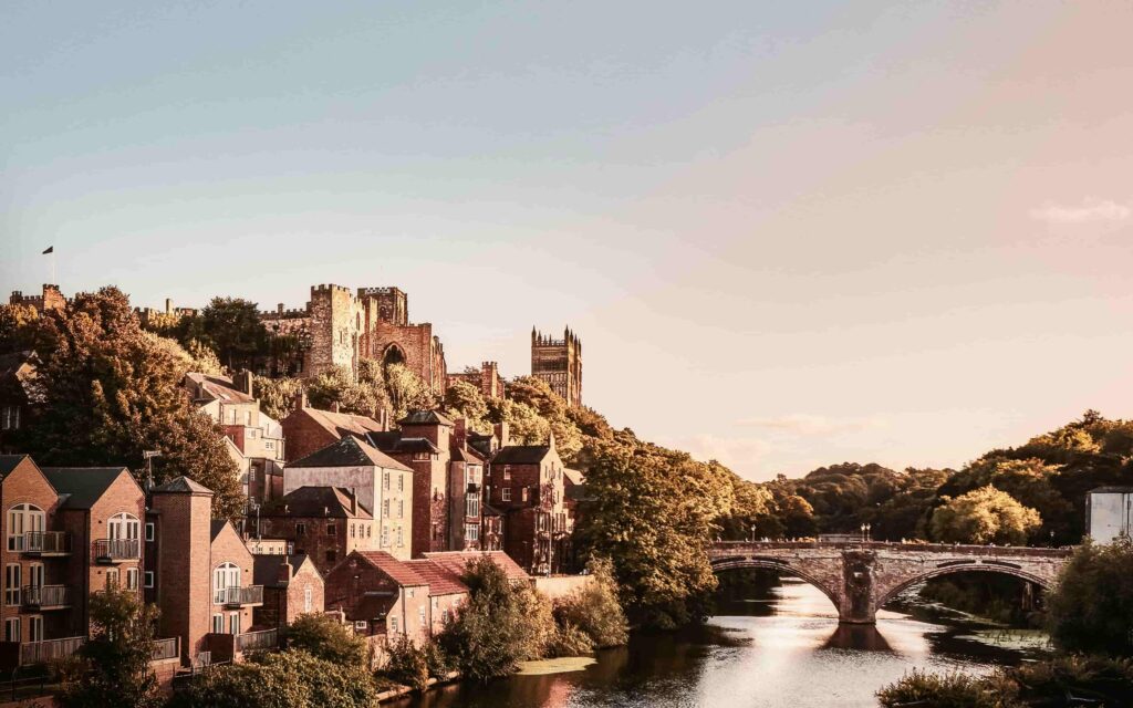 Norman medieval Castle and Cathedral stand on a hill above the River Wear and the Framwellgate Bridge in Durham