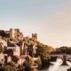 Norman medieval Castle and Cathedral stand on a hill above the River Wear and the Framwellgate Bridge in Durham